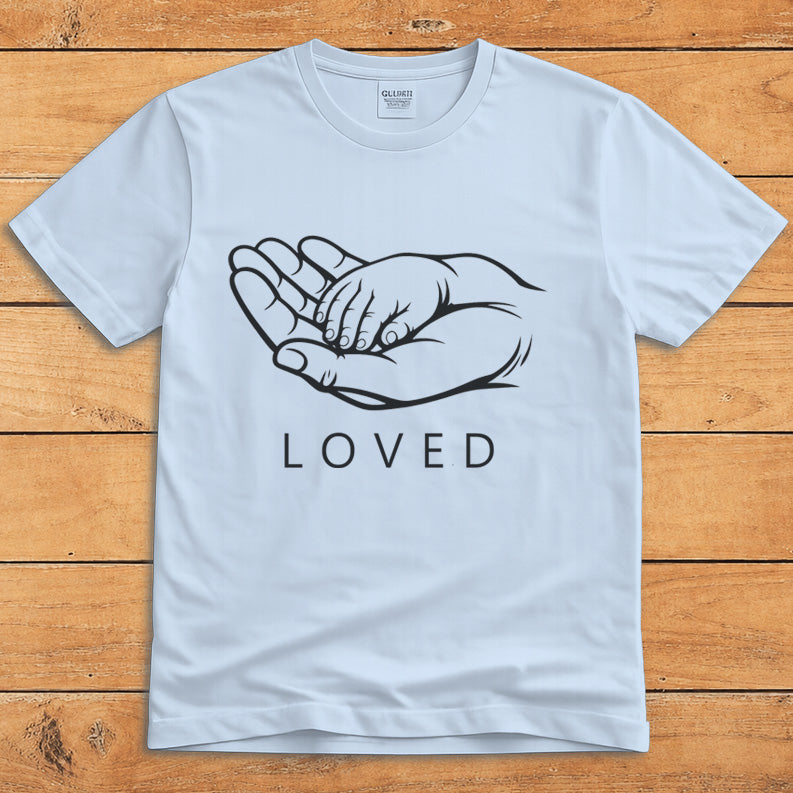 Light blue parent T-shirt showing a grown-up holding a child’s hand alongside the word “LOVED”