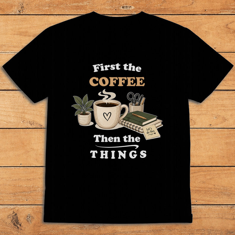 Black coffee T-shirt with a steaming mug and the words “First the Coffee, Then the Things”