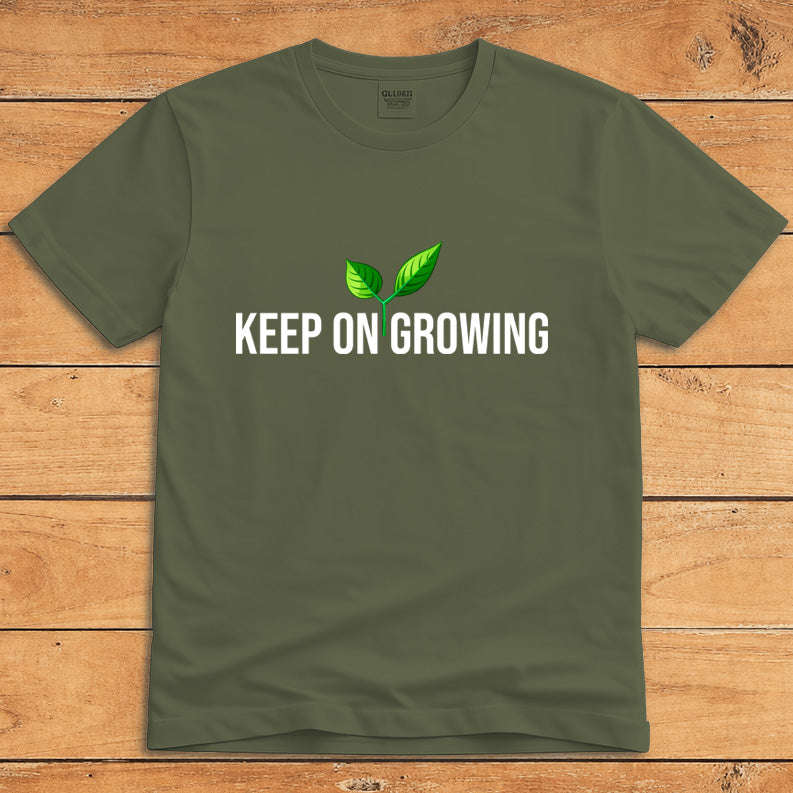 Military green plant lover T-shirt featuring a green sprout and the words “Keep on Growing”