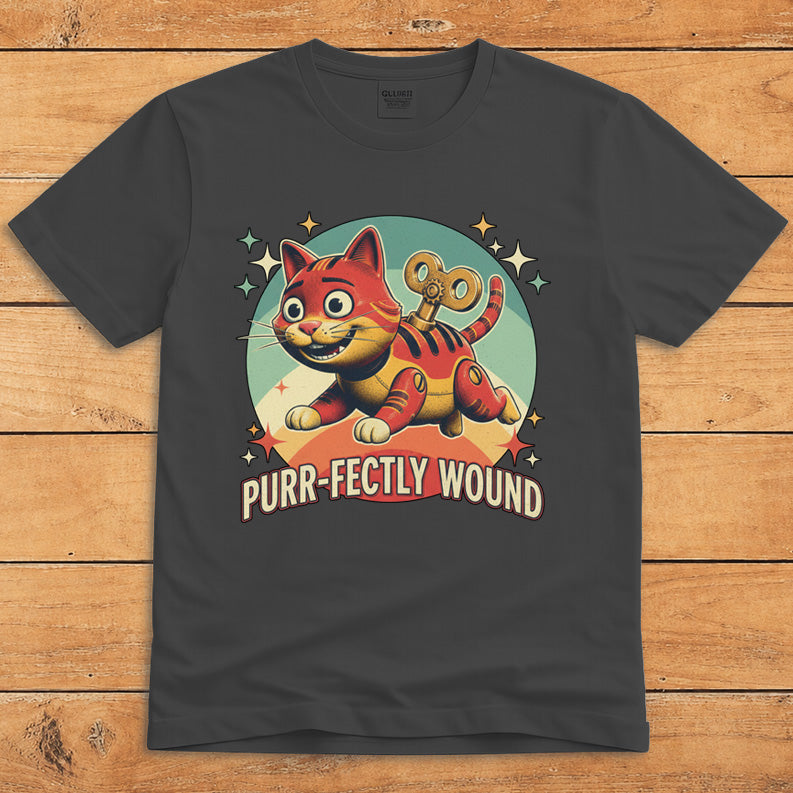 Dark heather funny cat T-shirt featuring a retro wind-up toy and the words “Purr-fectly Wound”