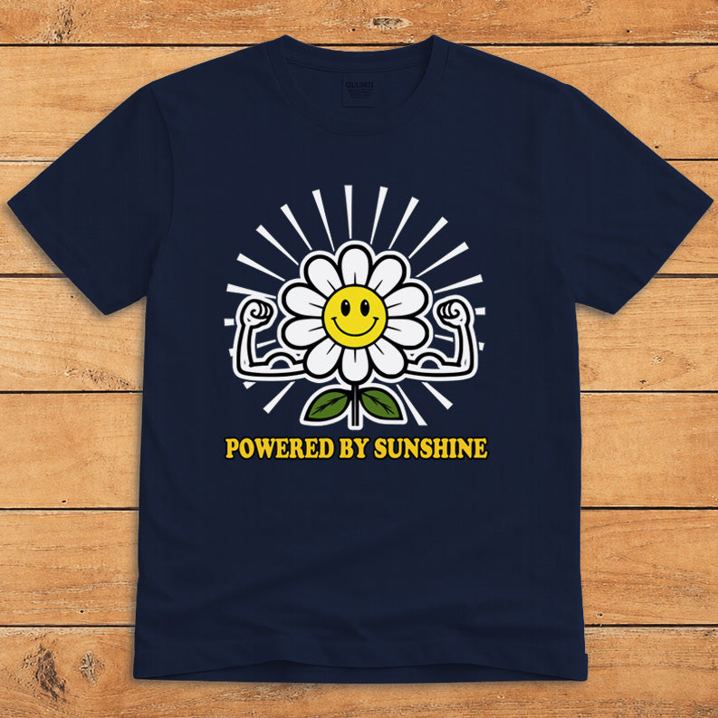 Navy sunshine T-shirt featuring a smiling daisy flexing its arms and the words “Powered by Sunshine”